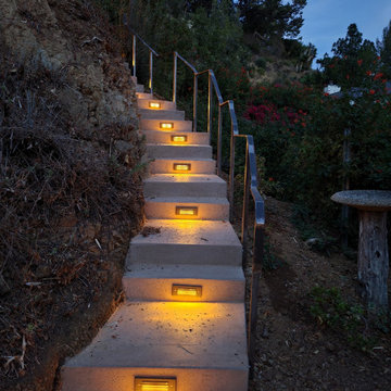 Hillside stairs, custom rail and lighting