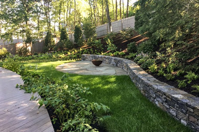 Photo of a traditional backyard stone landscaping in Boston.