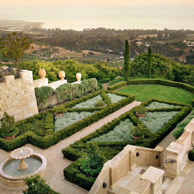 This is an example of a mid-sized mediterranean full sun backyard gravel formal garden in San Francisco.