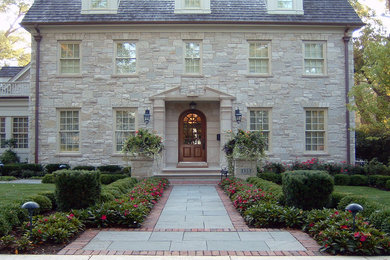 Design ideas for a large traditional front garden in Chicago with a garden path and brick paving.