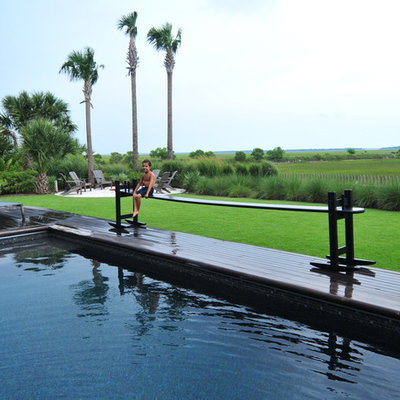Photo of a large traditional backyard landscaping in Charleston with decking.