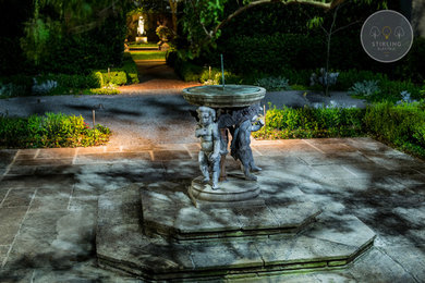 Photo of a traditional courtyard stone garden path in Houston.