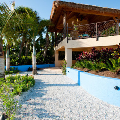 Inspiration for a tropical retaining wall landscape in Portland.
