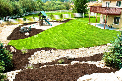 Inspiration for a large full sun backyard landscaping in Salt Lake City for spring.