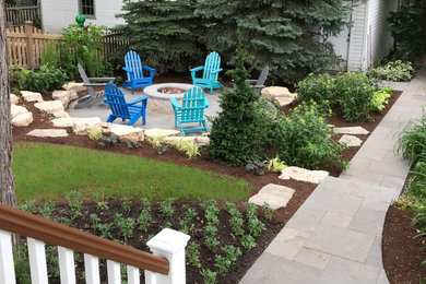 Design ideas for a traditional partial sun backyard stone landscaping in Chicago.