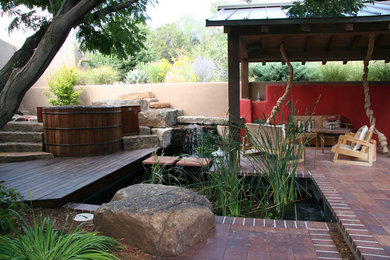 Design ideas for a small asian courtyard brick water fountain landscape in Albuquerque.
