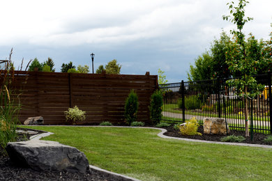 Photo of a large traditional backyard landscaping in Edmonton.