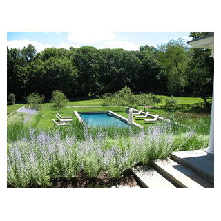 Infinity edge pool, stone walls, perennials and lawn - Contemporary ...