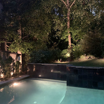 Infinity pool, patio, and landscape lighting in Toronto