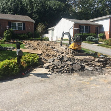 Initial demolition of existing driveway and landscape space