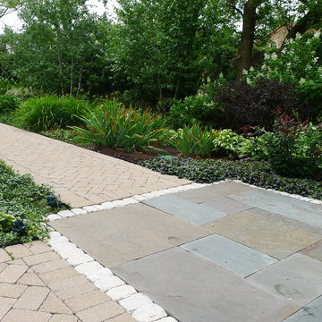 Intersecting Garden Paths: Bluestone, Tumbled Concete, and Cobbles