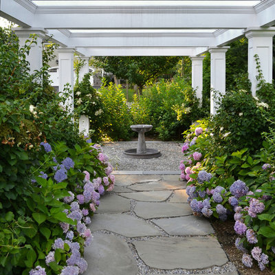 Photo of a traditional side yard stone garden path in New York.