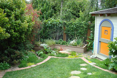 Photo of a small eclectic partial sun backyard brick landscaping in San Francisco for summer.
