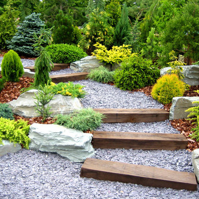Photo of a traditional hillside gravel garden path in New York.