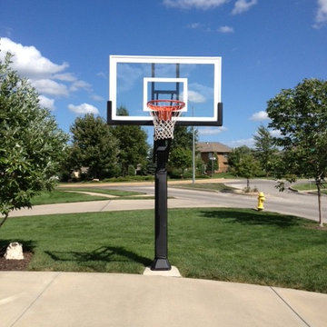 Jim G's Pro Dunk Gold Basketball System on a 25x45 in Lee's Summit, MO