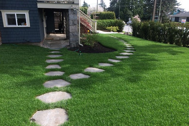 Design ideas for a large rustic partial sun side yard concrete paver garden path in Vancouver.
