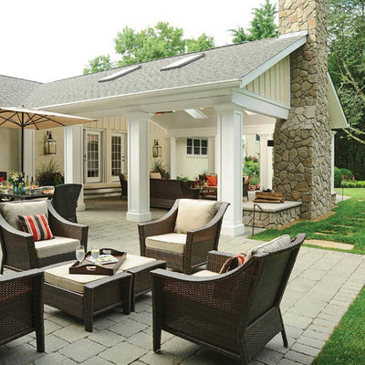 Design ideas for a huge traditional full sun backyard brick landscaping in Columbus with a fire pit for fall.