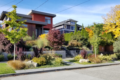 Inspiration for a contemporary drought-tolerant, rock and full sun front yard concrete paver landscaping in Seattle for fall.
