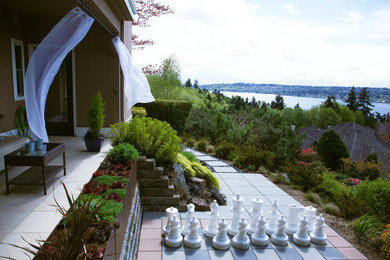 Diseño de jardín de secano contemporáneo de tamaño medio en patio lateral con exposición total al sol y adoquines de hormigón