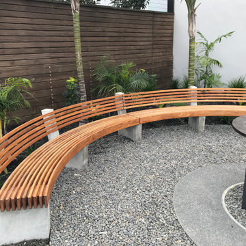 Kohimarama. Rear garden seating and fire pit.