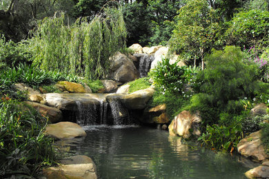 This is an example of a large mediterranean partial sun water fountain landscape in Santa Barbara.