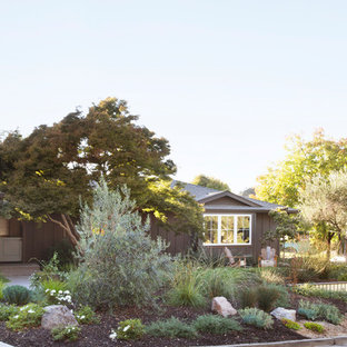 This is an example of a transitional front yard concrete paver formal garden.