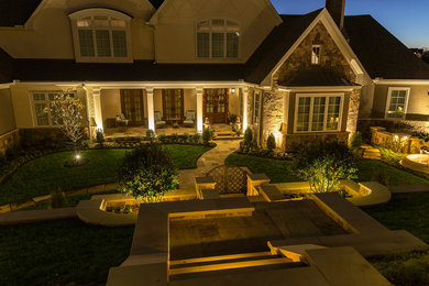 This is an example of a large traditional front yard landscaping in Other.