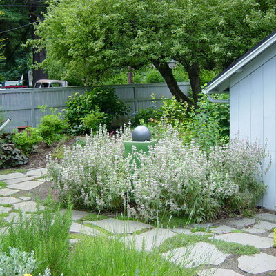 Photo of a traditional stone landscaping in Portland.