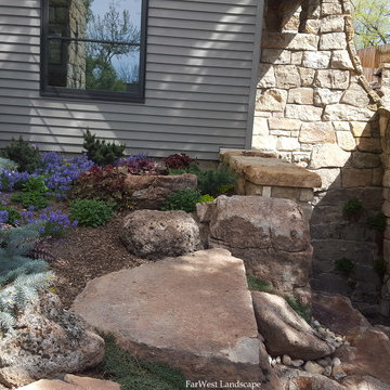 Landscape bed with boulders & pathway