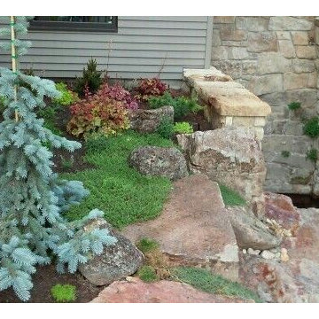 Landscape bed with boulders & pathway