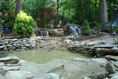 Inspiration for a large full sun backyard landscaping in Raleigh.