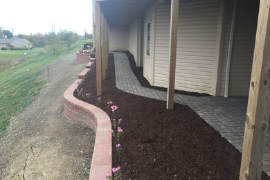This is an example of a large backyard stone landscaping in Other.