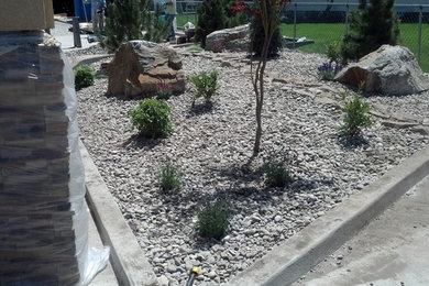 This is an example of a mid-sized full sun backyard concrete paver landscaping in Boise.