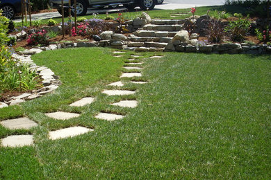 Photo of a mid-sized traditional partial sun front yard stone garden path in San Francisco for spring.