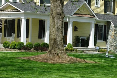 Design ideas for a mid-sized partial sun front yard concrete paver landscaping in DC Metro.