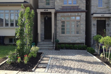 This is an example of a small craftsman front yard brick landscaping in Toronto.