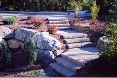 This is an example of a mid-sized partial sun backyard stone garden path in New York.