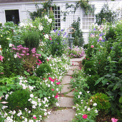 Inspiration for a traditional backyard stone landscaping in Boston.