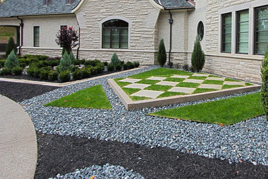 Inspiration for a front yard concrete paver landscaping in Other.