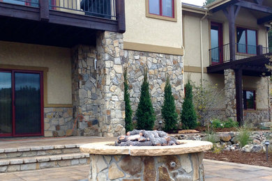 Example of a large classic patio design in Denver