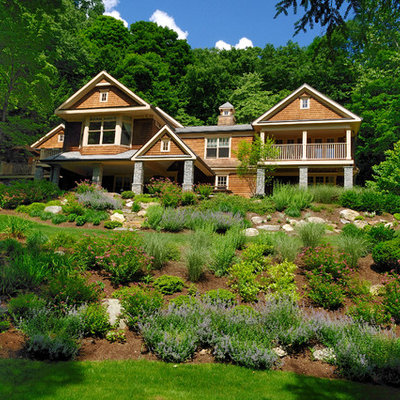 This is an example of a mid-sized rustic partial sun backyard mulch formal garden in New York.