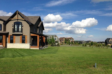 Photo of a mid-sized craftsman full sun side yard landscaping in Calgary for summer.
