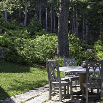 Inspiration for a rustic backyard stone landscaping in Boston.