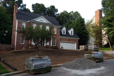 This is an example of a mid-sized front yard landscaping in Raleigh.