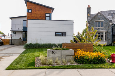 This is an example of a small modern drought-tolerant front yard landscaping in Calgary.