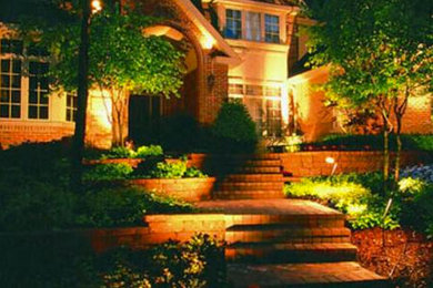This is an example of a medium sized front full sun garden in Denver with a garden path and brick paving.