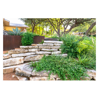 Limestone Boulder Retaining Walls - Contemporary - Landscape - Austin