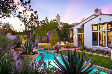 Inspiration for a mid-sized mediterranean backyard landscaping in Los Angeles.