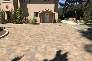 Photo of a large mediterranean full sun front yard concrete paver driveway in San Luis Obispo for fall.