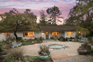 Inspiration for a large farmhouse drought-tolerant and full sun front yard gravel water fountain landscape in Santa Barbara.